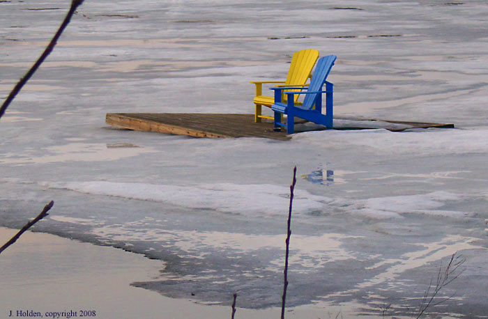 Meech Lake thaw and lawn chairs