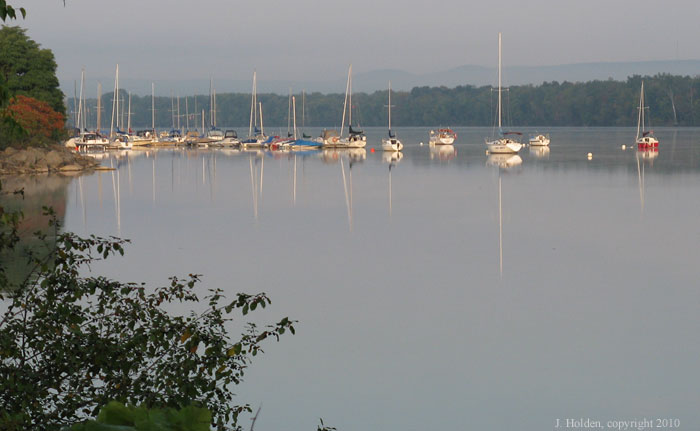 Calm Ottawa River, Gatineau Hills in the distance